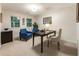 Functional office with natural light, with two chairs and a large desk and neutral decor at 3275 Lord N Lady Ln, Alpharetta, GA 30022
