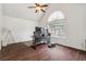 Bright bedroom featuring a vaulted ceiling, wooden floors, and a large window providing natural light at 4515 Ambassador Way, Cumming, GA 30040