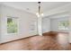 Dining room with hardwood floors, neutral walls, and views to living spaces at 4515 Ambassador Way, Cumming, GA 30040