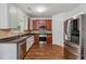 Well-equipped kitchen with stainless steel appliances, granite countertops, and modern finishes at 4515 Ambassador Way, Cumming, GA 30040