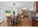 Eat-in kitchen with stainless appliances, granite counters, and abundant natural light at 4515 Ambassador Way, Cumming, GA 30040