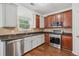 This kitchen offers stainless steel appliances, tile backsplash, and a modern sink and faucet at 4515 Ambassador Way, Cumming, GA 30040