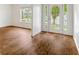 Bright living room with hardwood flooring, ample natural light, and classic molding at 4515 Ambassador Way, Cumming, GA 30040