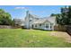Two-story home back exterior with patio and fenced yard at 4578 Score Ct, Snellville, GA 30039