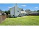 Two-story home back exterior with patio and fenced yard at 4578 Score Ct, Snellville, GA 30039