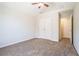 Neutral bedroom features vaulted ceiling, ceiling fan, neutral carpet, and double-door closet at 4578 Score Ct, Snellville, GA 30039