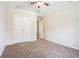 Neutral bedroom features vaulted ceiling, ceiling fan, neutral carpet, and double-door closet at 4578 Score Ct, Snellville, GA 30039