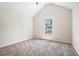 Bedroom with carpet and a large window offering natural light at 4578 Score Ct, Snellville, GA 30039