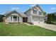 Charming two-story home features a well-manicured lawn and a two-car garage at 4578 Score Ct, Snellville, GA 30039