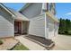 Charming home with red front door, two-car garage, manicured garden bed, and walkway at 4578 Score Ct, Snellville, GA 30039