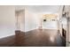 Open living room featuring dark hardwood floors, a fireplace, and lots of natural light at 4578 Score Ct, Snellville, GA 30039