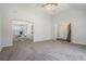 Open floor plan with a spacious living area, neutral carpet, and easy access to dining at 4578 Score Ct, Snellville, GA 30039