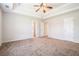 Large main bedroom with a ceiling fan and neutral-toned carpet at 4578 Score Ct, Snellville, GA 30039