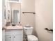 Powder room with toilet and single sink vanity at 4578 Score Ct, Snellville, GA 30039