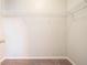 Walk-in closet featuring carpet and a wire shelf to help maximize organization at 4578 Score Ct, Snellville, GA 30039