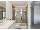 Modern bathroom featuring a glass-enclosed shower, updated fixtures, and a single sink vanity at 178 Munira Sw Ln, Atlanta, GA 30331