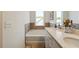 Bright bathroom featuring a soaking tub, double sink vanity with granite counters and modern fixtures at 178 Munira Sw Ln, Atlanta, GA 30331