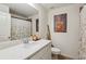 Bathroom with a white vanity, single sink, mirror, and a shower with curtain at 178 Munira Sw Ln, Atlanta, GA 30331