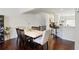 Dining room with hardwood floors, white and wood table, and seating for six at 178 Munira Sw Ln, Atlanta, GA 30331