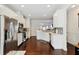 Updated kitchen with stainless steel appliances, modern white cabinetry, and dark wood floors at 178 Munira Sw Ln, Atlanta, GA 30331