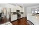 Well-lit kitchen featuring stainless steel appliances, granite countertops, and mosaic tile backsplash at 178 Munira Sw Ln, Atlanta, GA 30331