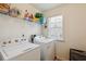 Functional laundry room with appliances and storage space at 178 Munira Sw Ln, Atlanta, GA 30331