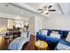 Bright living room with hardwood floors, modern ceiling fan, and comfortable blue sectional sofa at 178 Munira Sw Ln, Atlanta, GA 30331