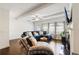 Bright living room featuring a comfortable blue sectional sofa and hardwood floors at 178 Munira Sw Ln, Atlanta, GA 30331