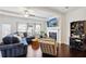 Spacious living room boasting a fireplace, hardwood floors, and a stylish bar cabinet at 178 Munira Sw Ln, Atlanta, GA 30331