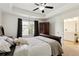 Bright bedroom with tray ceilings, neutral carpet, and natural light at 178 Munira Sw Ln, Atlanta, GA 30331