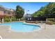 Community swimming pool with lounge chairs and barbecue grill at 178 Munira Sw Ln, Atlanta, GA 30331