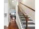 Hardwood staircase with white trim leading to the upper level of the home at 178 Munira Sw Ln, Atlanta, GA 30331