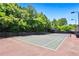 Community tennis court surrounded by lush greenery at 178 Munira Sw Ln, Atlanta, GA 30331