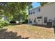 A view of the back exterior and yard from a slightly different angle, showing lawn and AC unit at 2907 Timbercreek Cir, Roswell, GA 30076