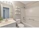Clean bathroom with a tub-shower, a white vanity, and modern floating shelves at 2907 Timbercreek Cir, Roswell, GA 30076