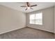 Inviting bedroom with carpet, a ceiling fan, and a window offering natural light at 2907 Timbercreek Cir, Roswell, GA 30076