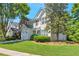 Beautiful two-story home featuring an attached garage, a well-maintained lawn, and lush landscaping at 2907 Timbercreek Cir, Roswell, GA 30076
