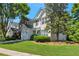 A pleasing view of the home's front exterior on a sunny day, showing lawn and landscaping at 2907 Timbercreek Cir, Roswell, GA 30076