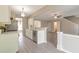 Open concept kitchen with white cabinets, marble countertops, and stainless steel appliances at 2907 Timbercreek Cir, Roswell, GA 30076