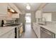 Modern kitchen featuring stainless steel appliances and stylish marble countertops and backsplash at 2907 Timbercreek Cir, Roswell, GA 30076