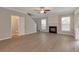 Open living room featuring a fireplace, lots of natural light, modern flooring, and staircase at 2907 Timbercreek Cir, Roswell, GA 30076