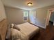 Bedroom featuring hardwood floors, a bed, and natural light at 3240 Columbia Oaks Way, Decatur, GA 30032