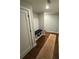 Welcoming hallway with hardwood floors, a built-in bench, and access to the upper level at 3240 Columbia Oaks Way, Decatur, GA 30032