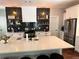 Modern kitchen featuring a large island, stainless steel appliances and a decorative black backsplash at 3240 Columbia Oaks Way, Decatur, GA 30032