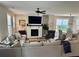 Comfortable living room with a large sectional sofa, fireplace, and open layout leading to the dining area at 3240 Columbia Oaks Way, Decatur, GA 30032