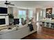 Inviting living area with a cozy fireplace, stylish decor, and an open layout connecting to the dining space at 3240 Columbia Oaks Way, Decatur, GA 30032