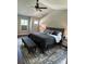 Serene main bedroom featuring a tray ceiling, neutral tones, and a comfortable sitting area at 3240 Columbia Oaks Way, Decatur, GA 30032