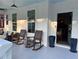Cozy porch with comfortable rocking chairs, a stylish outdoor seating area, and views of the surrounding greenery at 3240 Columbia Oaks Way, Decatur, GA 30032
