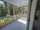Inviting screened porch overlooking lush greenery, perfect for enjoying the outdoors at 3240 Columbia Oaks Way, Decatur, GA 30032