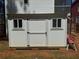 Functional outdoor shed with double windows and doors, providing ample storage space for tools and equipment at 3240 Columbia Oaks Way, Decatur, GA 30032